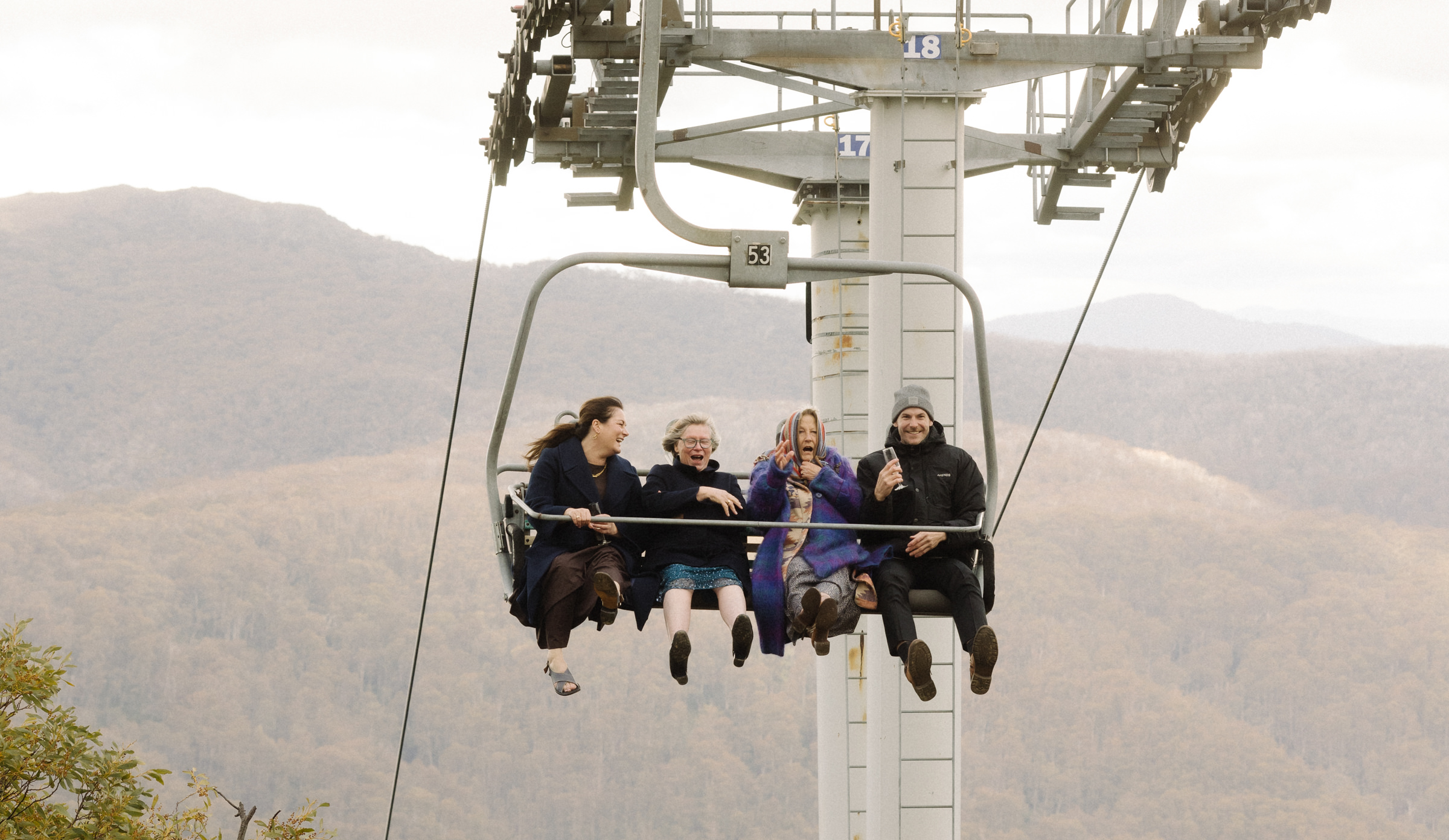 guests enjoy a ride on the chairlift during the wedding reception