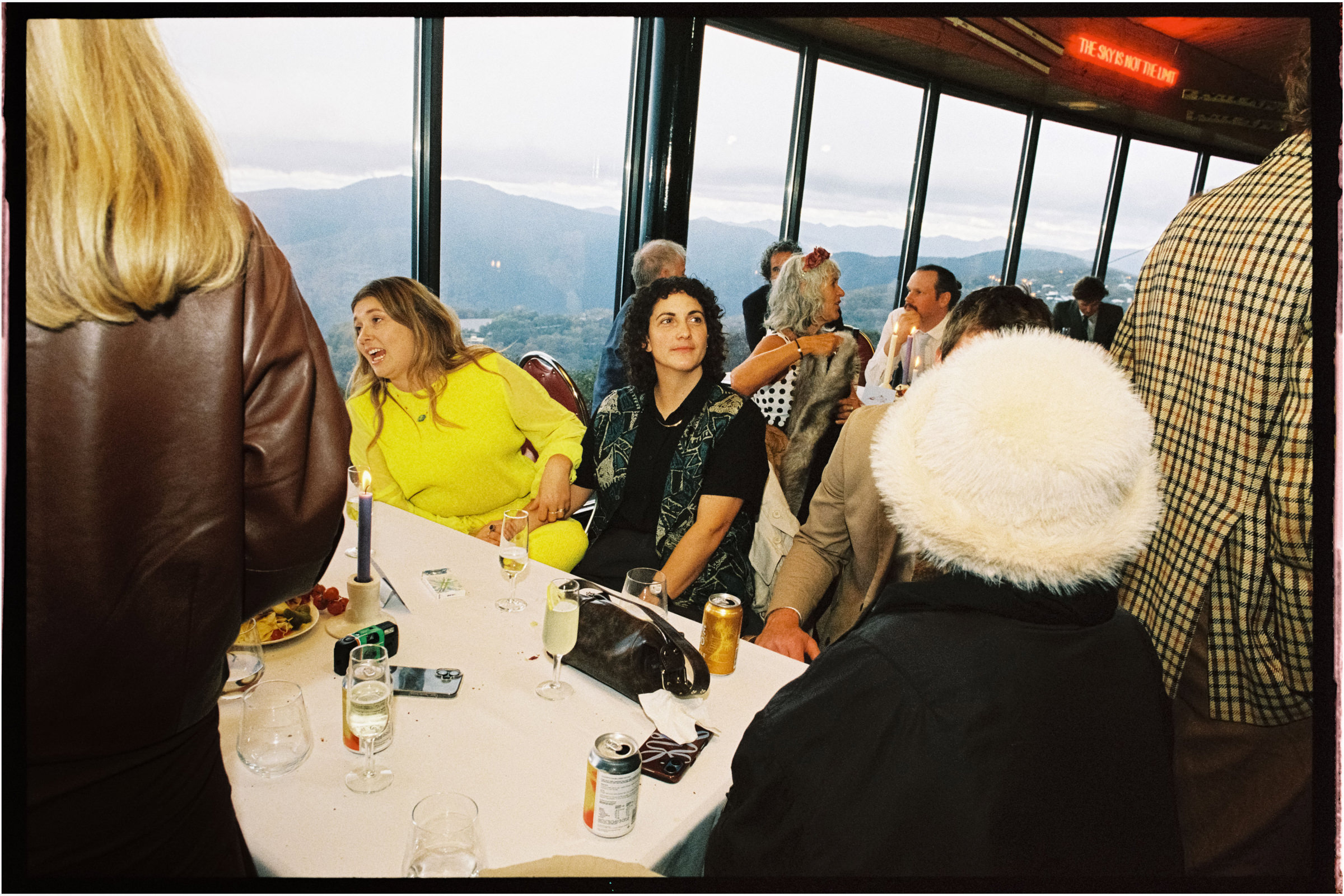 a film photo of guests enjoying themselves at a wedding reception