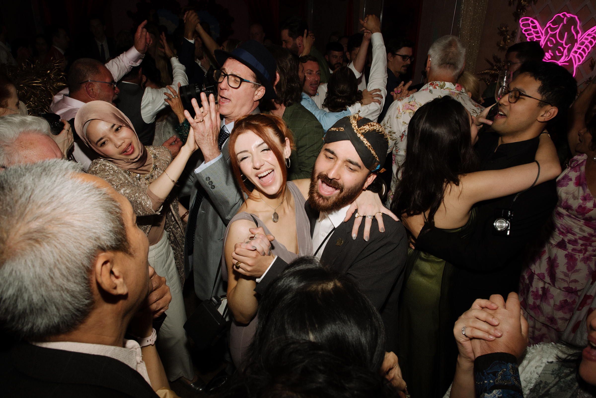 wedding guests dancing at the reception