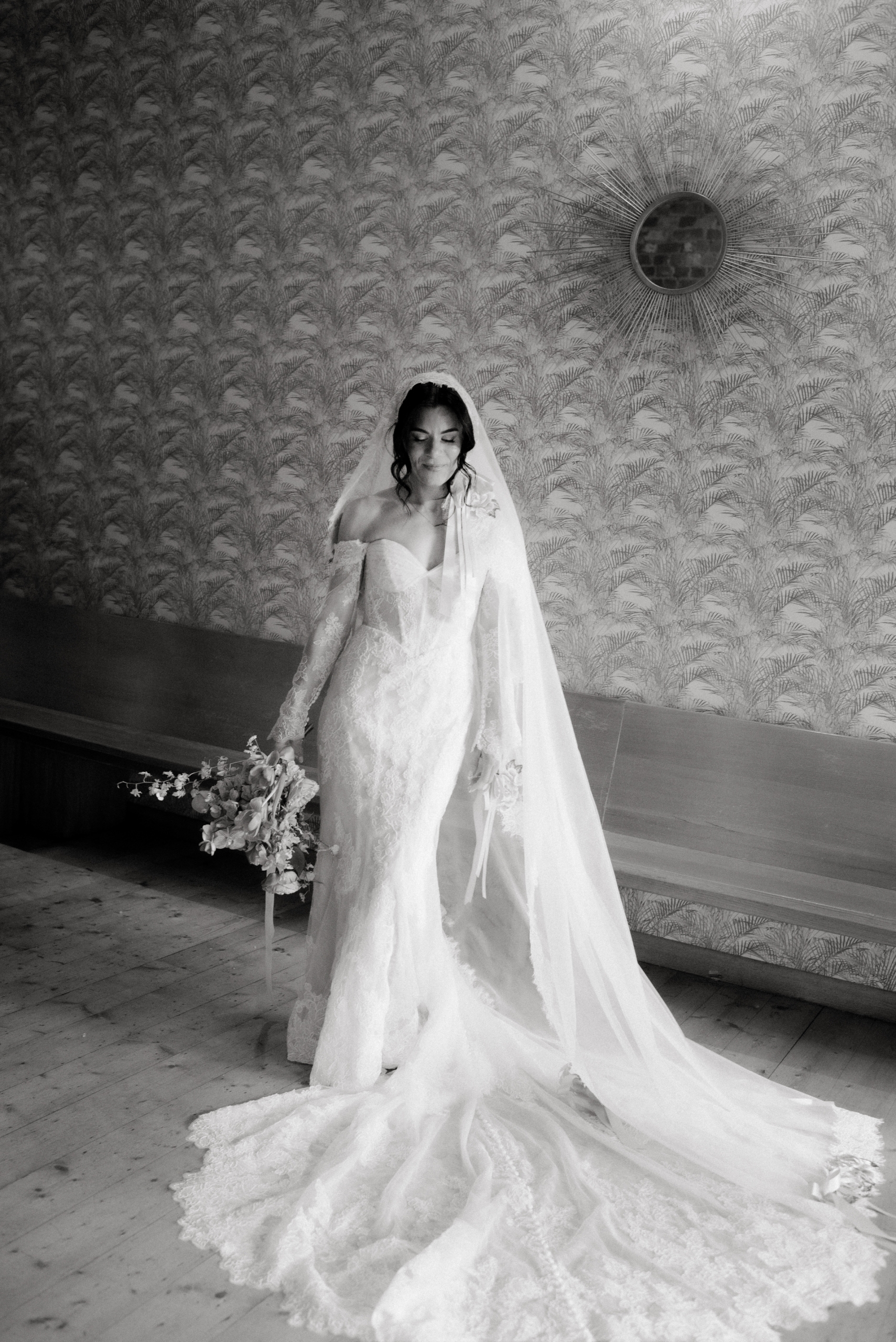 a black and white photo of the bride posing during the photo shoot