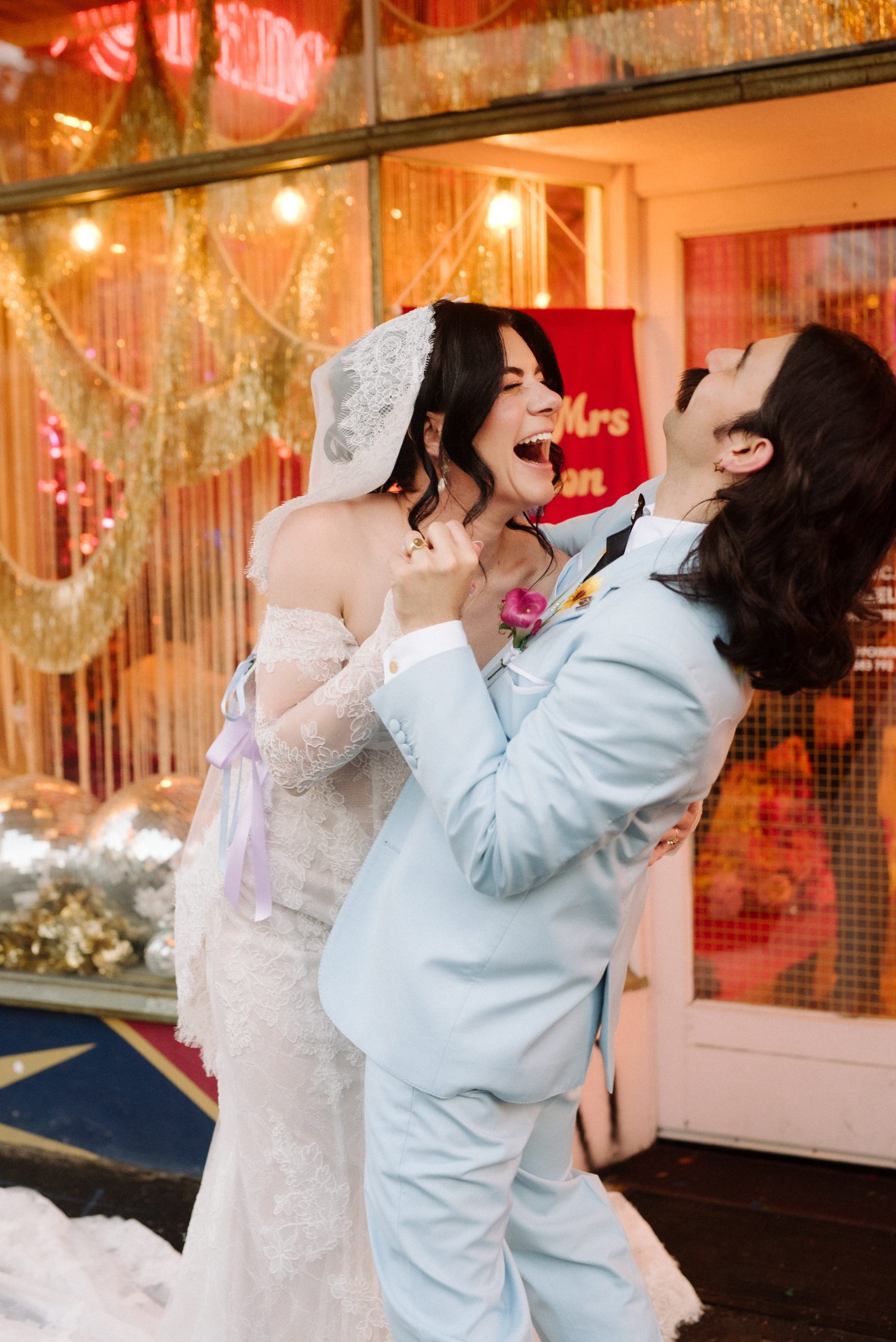 the bride and groom laughing during their photo portrait session