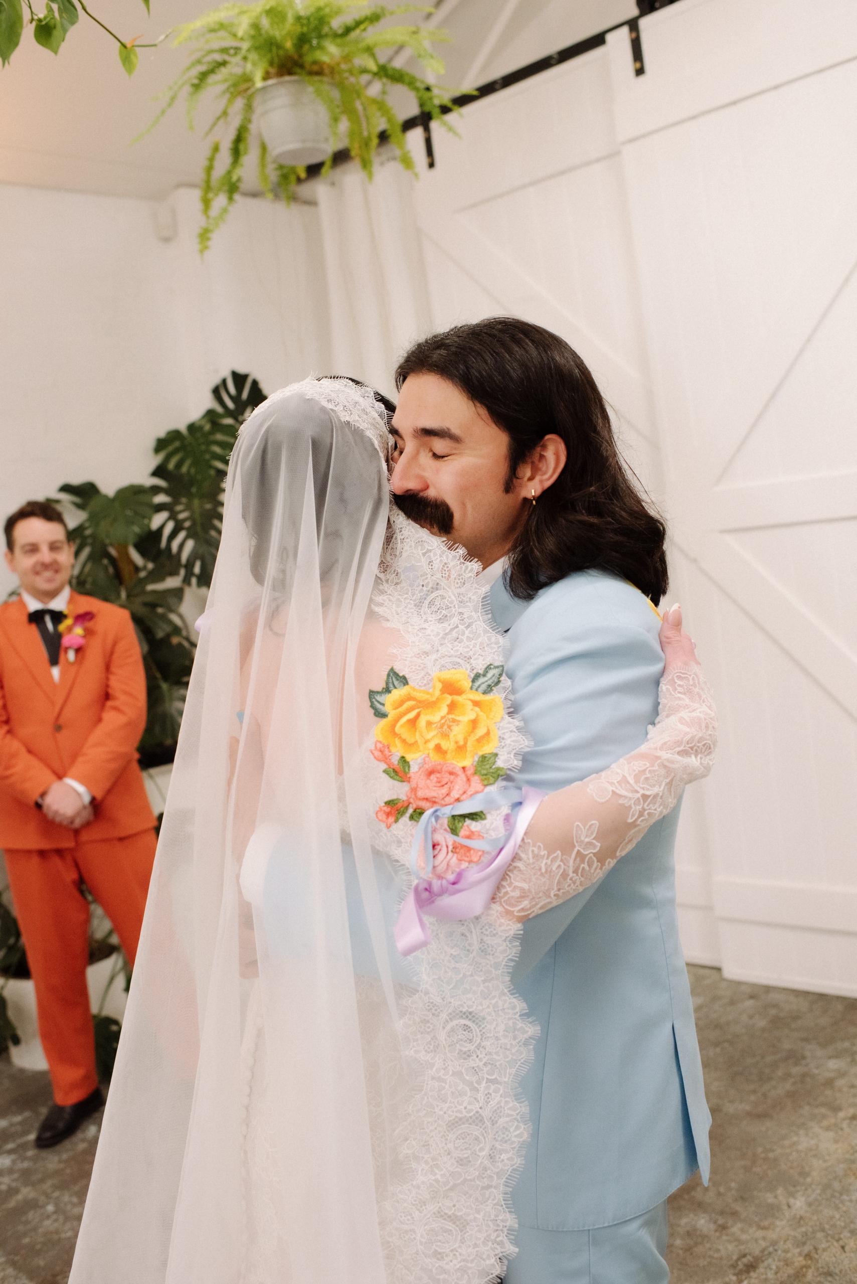 the bride and groom hug during their first look